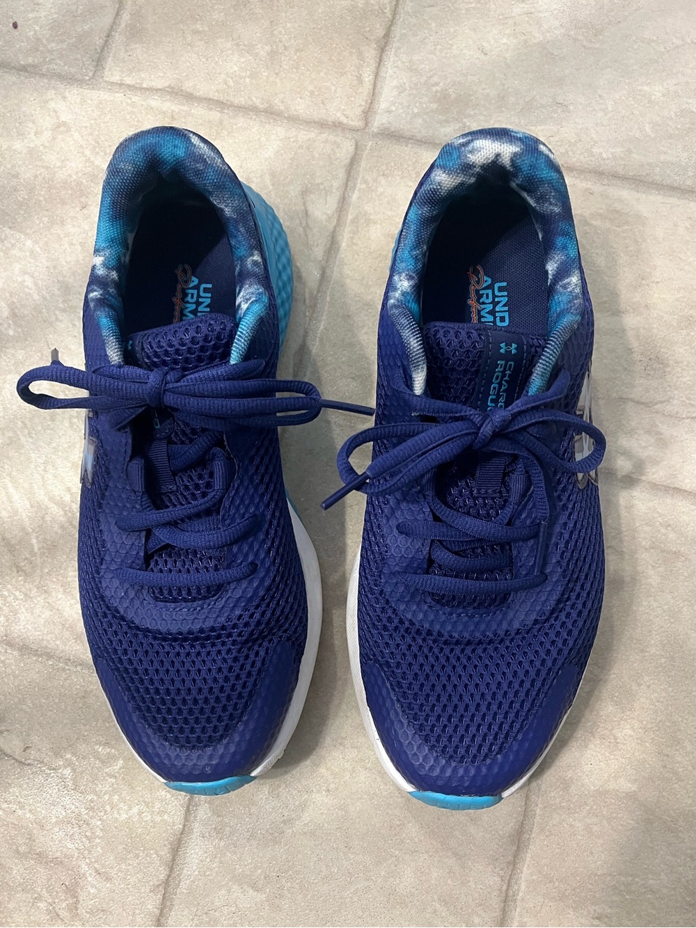 Under Armour Charged Rogue running shoes. Purple and teal. 6y or 7.5-8 women.